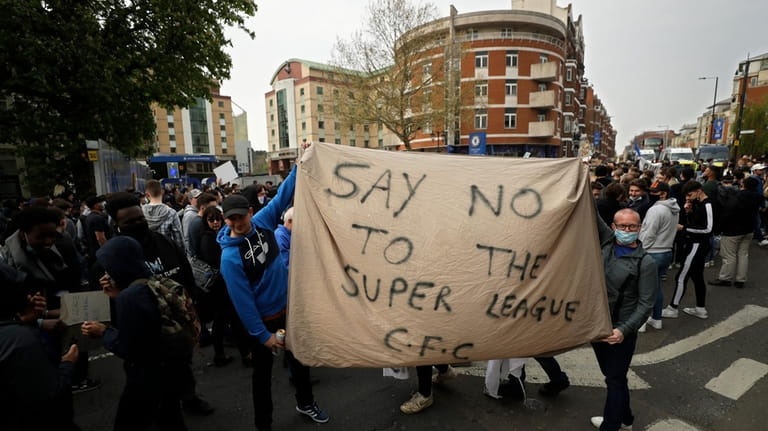 Chelsea fans protest outside Stamford Bridge stadium in London, against...