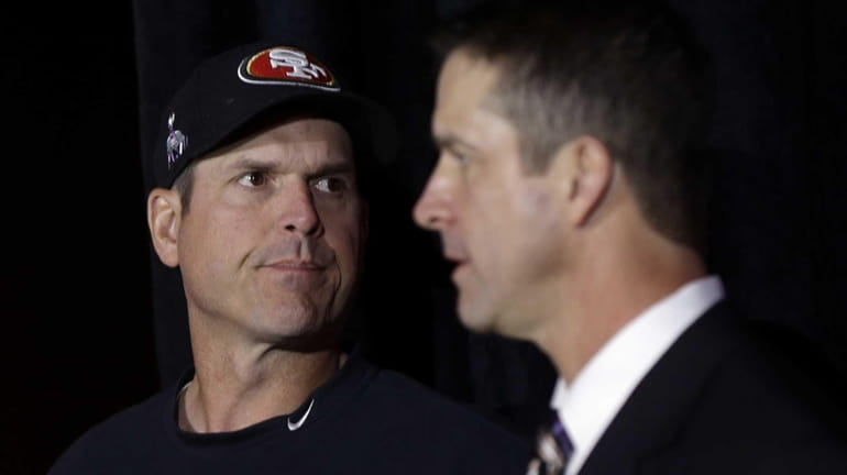 Brothers Jim Harbaugh, left, head coach for the San Francisco...