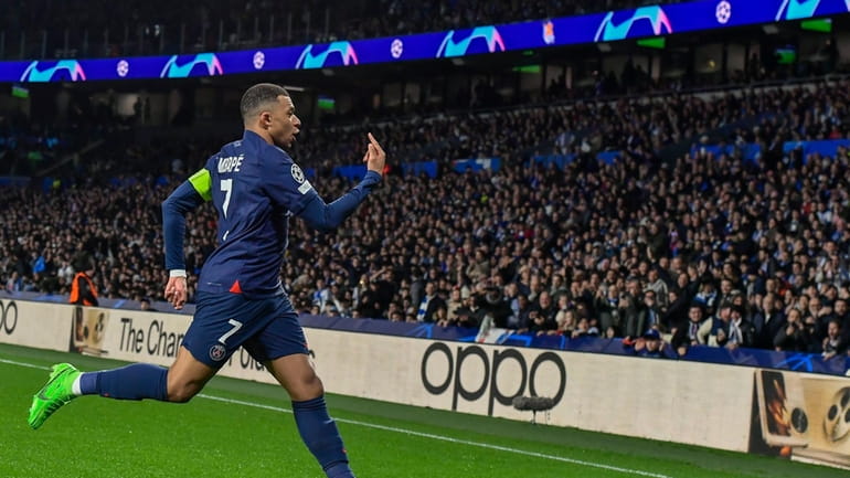 PSG's Kylian Mbappe celebrates after scoring his side's opening goal...