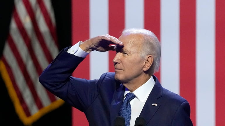 President Joe Biden pauses while speaking about democracy and the...