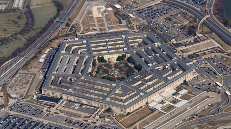 The Pentagon is seen from Air Force One as it...