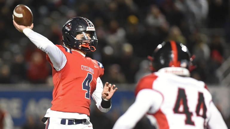 Owen West #4, South Side quarterback, throws a pass during...