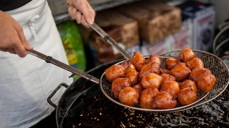A freshly cooked batch of zeppoles at the Feast of...