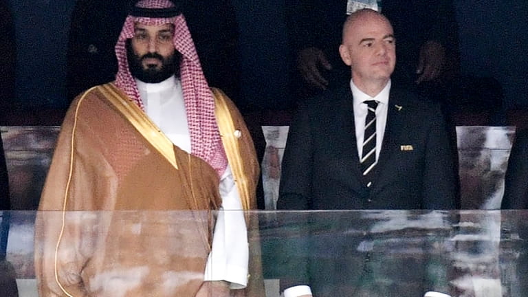 Saudi Arabia Crown Prince Mohammed bin Salman, left, and FIFA...