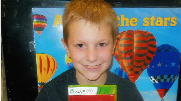 Cole Hennessy shows  off his Skylanders game.
