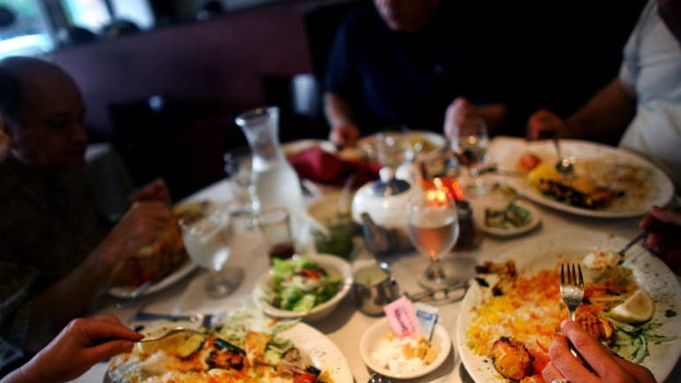 Patrons eat at Miraj Healthy Grill, a Persian restaurant in...