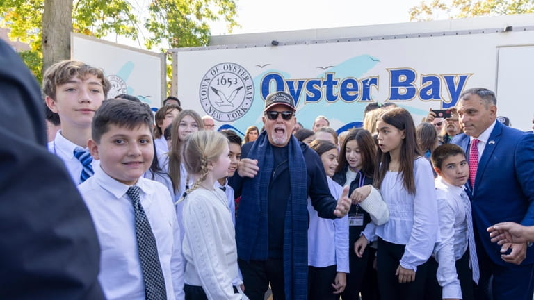 Billy Joel greets members of the sixth-grade Advanced Band from...
