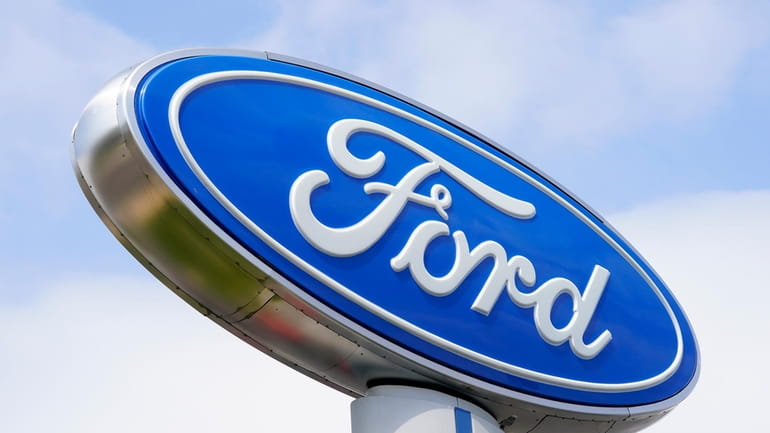 A Ford sign is shown at a dealership in Springfield,...