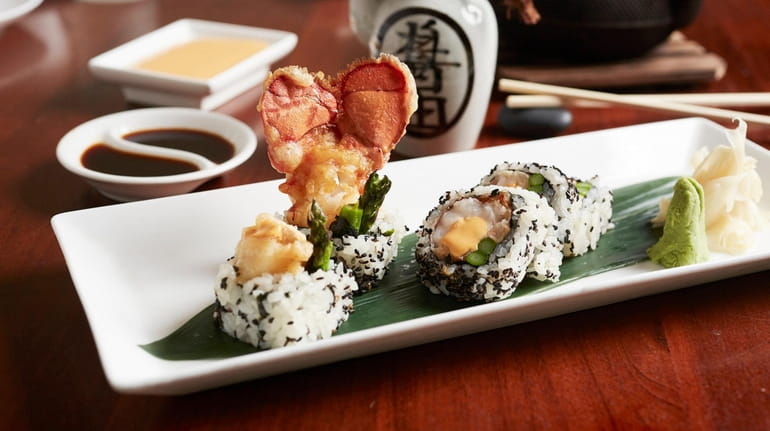 The Americana roll with Maine lobster tail tempura, asparagus, and...