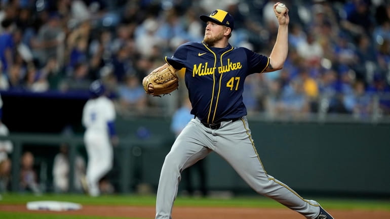Milwaukee Brewers pitcher Jared Koenig throws during the seventh inning...