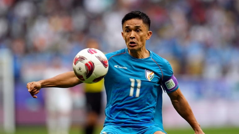 India's Sunil Chhetri controls the ball during the Asian Cup...