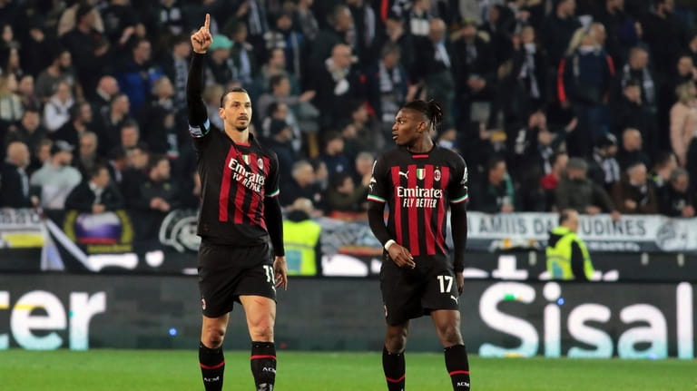 Milan's Zlatan Ibrahimovic, left, celebrates after scoring to 1-1 during...