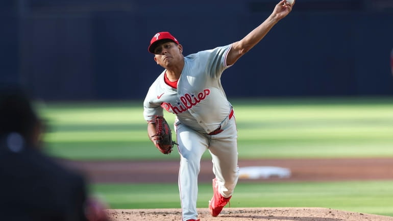 Philadelphia Phillies starting pitcher Ranger Suárez throws to a San...
