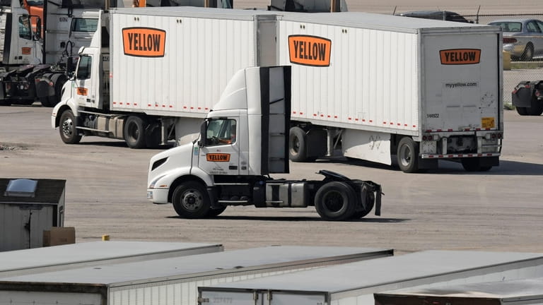 Yellow Corp. trucks navigate the YRC Freight terminal Friday, July...