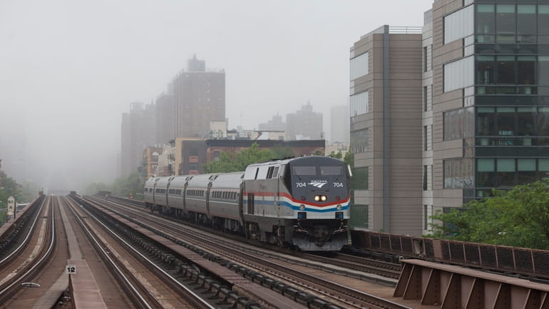 An Amtrak train nears Metro-North's 125th Street station in Manhattan.This week's...