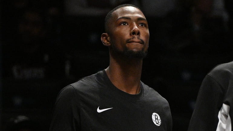 Nets forward Harry Giles III watches from the bench during...
