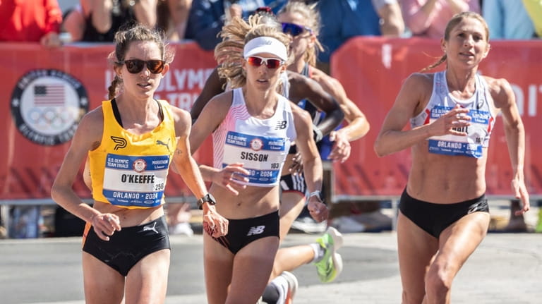 Fiona O'Keeffe, left, runs during the U.S. Olympic marathon trials...