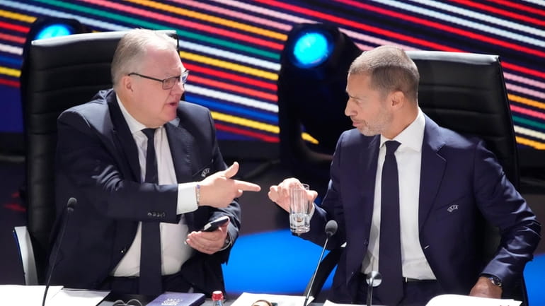 UEFA President Aleksander Ceferin, right, talks with member of executive...