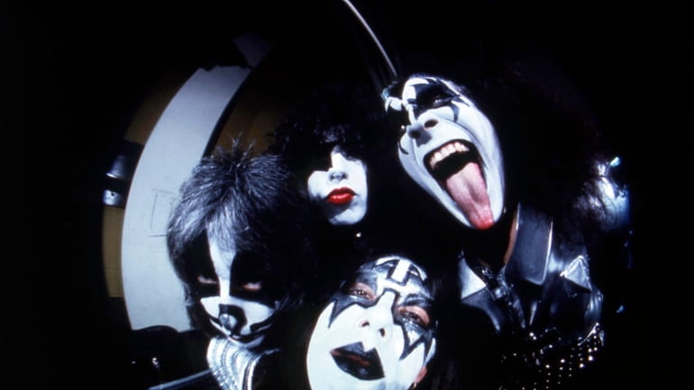 Members of the rock group KISS; Gene Simmons, clockwise from...