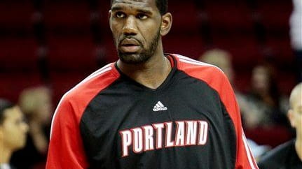 The Portland Trailblazers' Greg Oden warms up during a game...