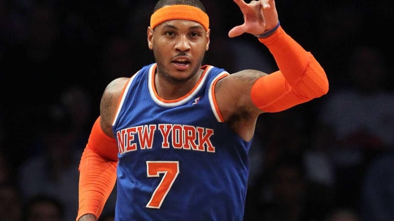 Carmelo Anthony of the New York Knicks celebrates a basket...