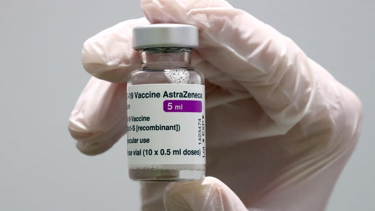 Medical staff prepares an AstraZeneca coronavirus vaccine during preparations at...