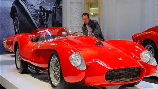 A visitor views the 1958 Ferrari 250 Testa Rossa, part...