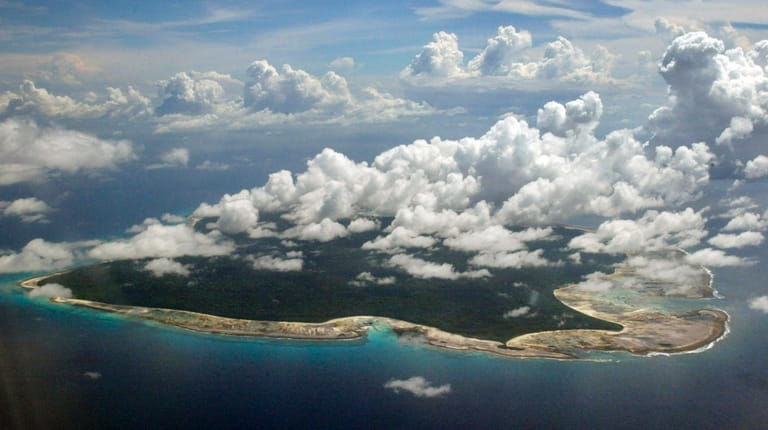 Clouds hang over the North Sentinel Island, in India's southeastern...
