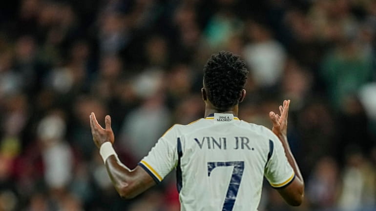 Real Madrid's Vinicius Junior celebrates after scoring his side's second...