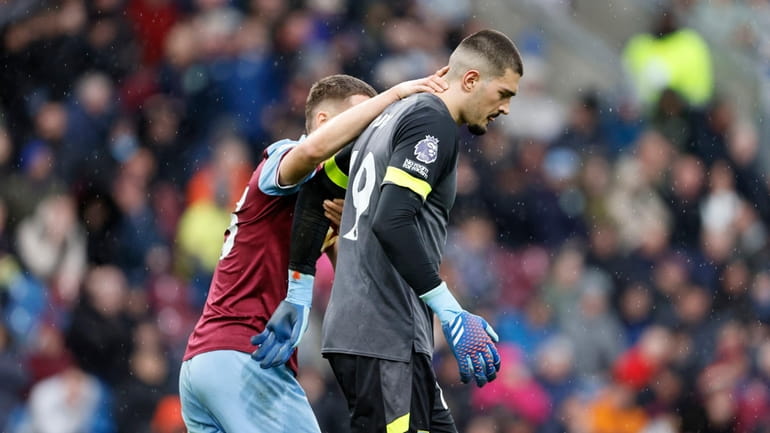 Burnley goalkeeper Arijanet Muric, right, reacts after conceding an own...