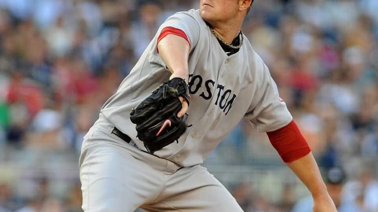 Boston Red Sox' Jon Lester (31) pitches to New York...
