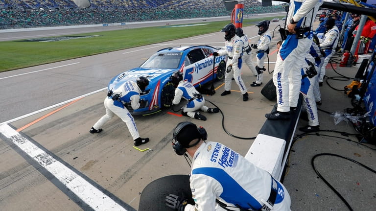 Kyle Larson stops on Pit Road for a tire change...
