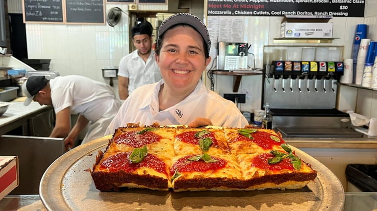 Owner Victoria Tiso with a Detroit-style pie at Tori T's...