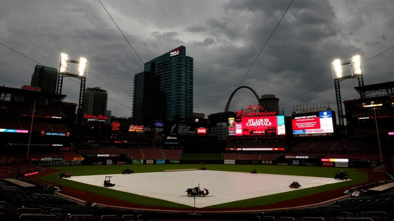 Clouds hang over Busch Stadium as weather delays the start...