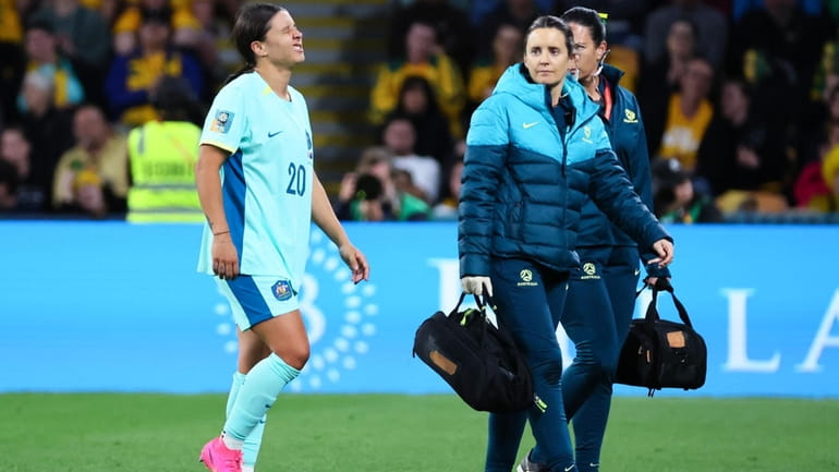 Australia's Sam Kerr reacts after she was injured in a...