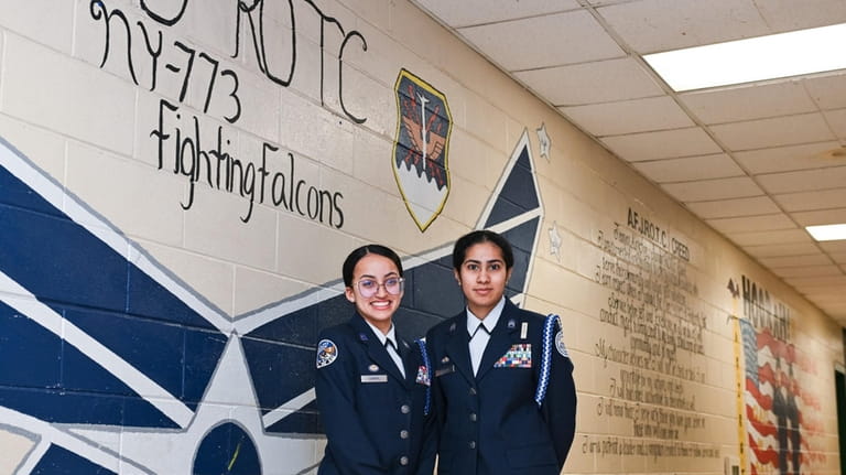 Alisha Arshad, right, student-commander of the JROTC at Brentwood High...