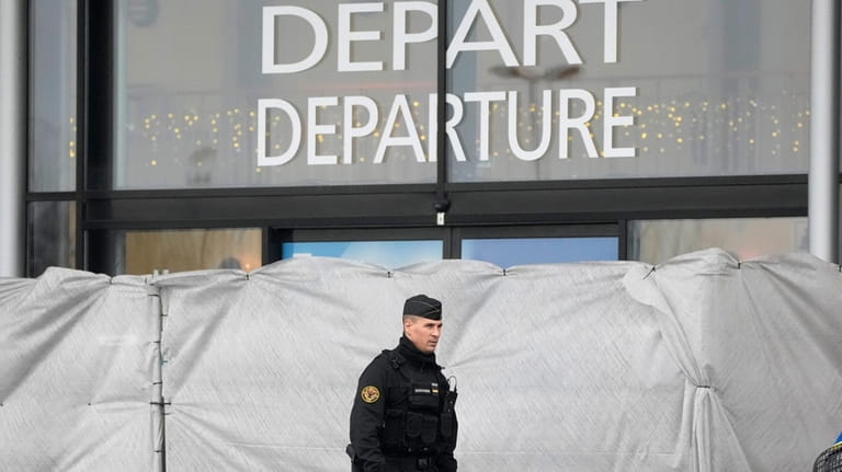A police officer patrols at the Vatry airport, eastern France,...