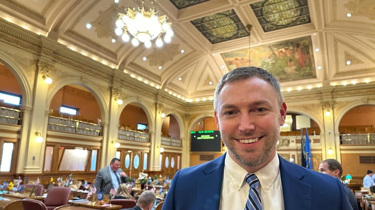 South Dakota Republican Rep. Jon Hansen stands in the House...