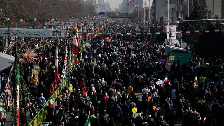 Iranians attend the annual rally commemorating their 1979 Islamic Revolution...
