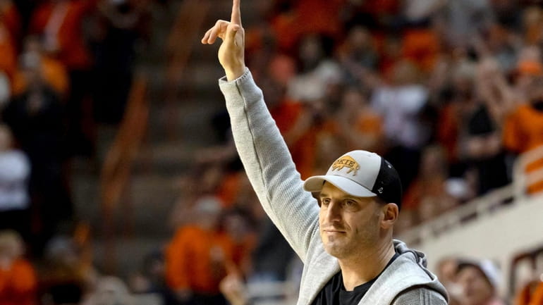 Oklahoma State alumnus Doug Gottlieb is acknowledged during the second...