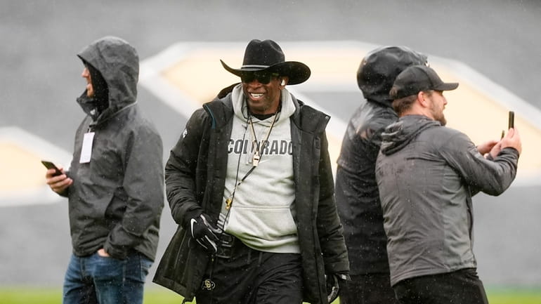 Colorado head coach Deion Sanders waits to direct players during...