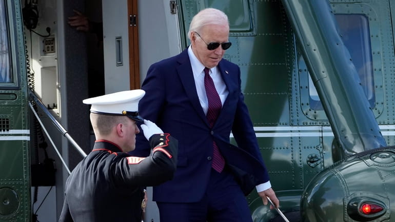 President Joe Biden arrives on Marine One to attend a...
