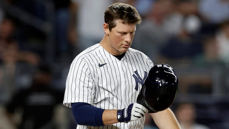 DJ LeMahieu of the Yankees reacts after striking out to end...