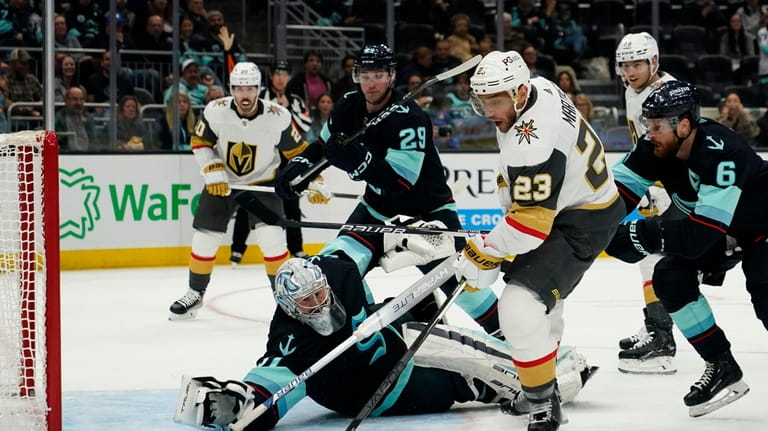 Vegas Golden Knights' Alec Martinez (23) saves a shot in front of