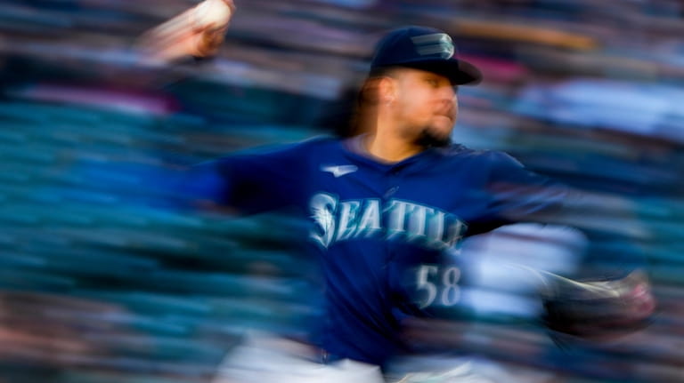 Seattle Mariners starting pitcher Luis Castillo throws against the Atlanta...