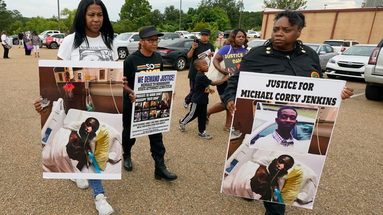 Activists march towards the Rankin County Sheriff's Office in Brandon,...