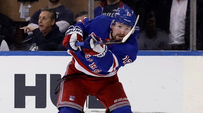 Alexis Lafreniere of the Rangers shoots the puck during the third period...