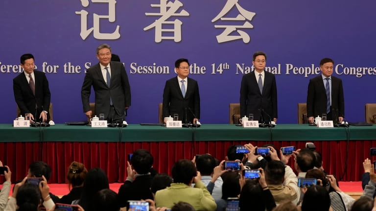 Key Chinese finance and economy officials from right, Governor of...