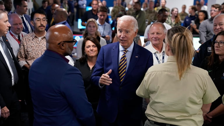 President Joe Biden speaks during a visit to FEMA headquarters,...