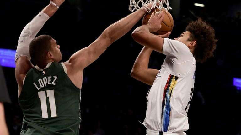 Brook Lopez of the Bucks blocks a shot in the...